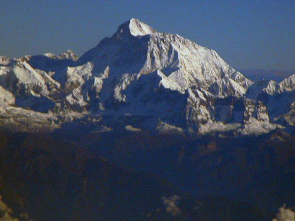 Manaslu 00 04 Makalu From Flight To Kathmandu As we waited for Kathmandu cloud cover to clear, we had a good early morning view of the sunlit South East face of Makalu.